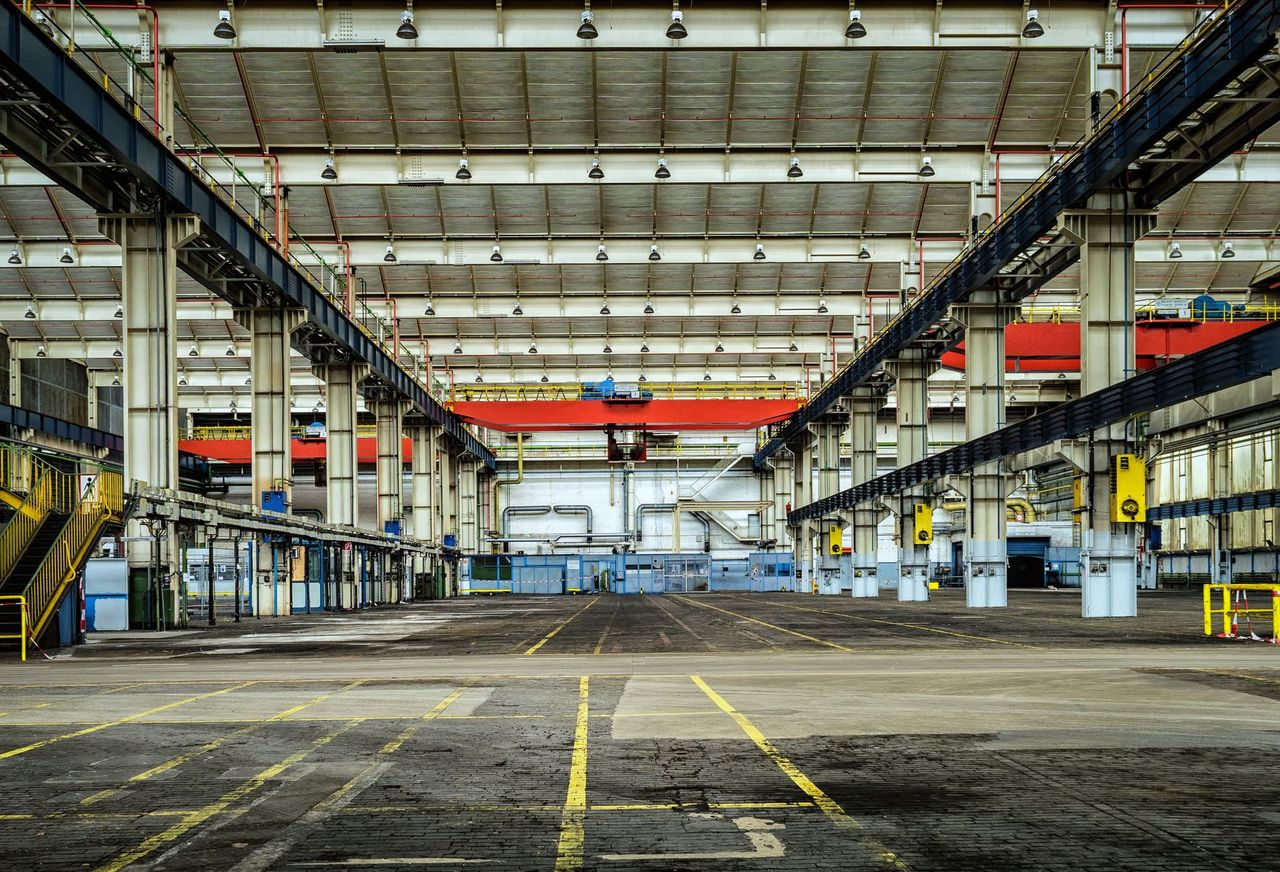 Industrial workshop hall with overhead cranes